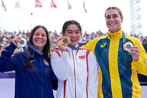 BMX freestyle women's park medal ceremony: Silver medalist Perris Benegas, gold medalist Deng Yawen and bronze medalist Natalya Diehm